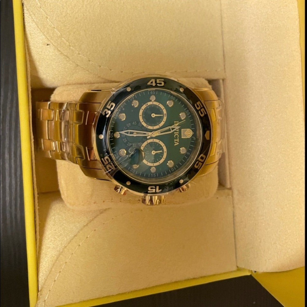 Green and gold invicta watch